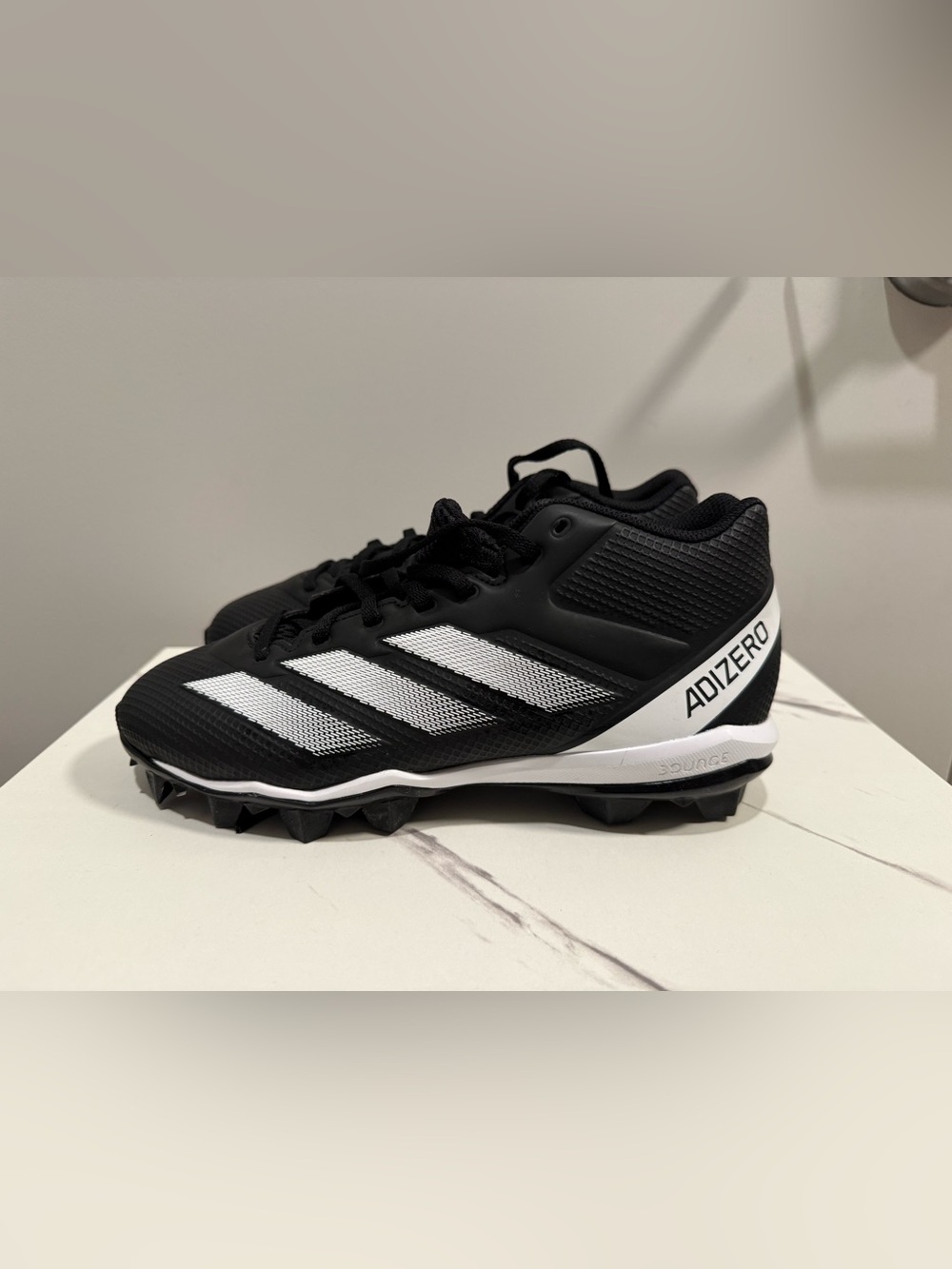 Adidas Adizero Black and White Football Cleats with Three-Stripe Design